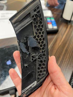 Broken glass and glue from when they replaced the windshield.