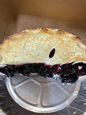 Blueberry pie cut in half