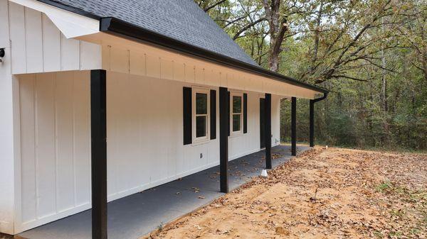 Black gutter on this beautiful white house trims it out nicely.