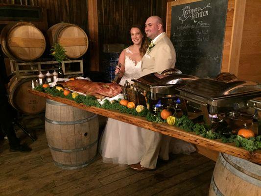 Happy Couple sharing the ceremonial First Cut of the pigroast !