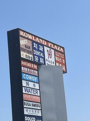 Gina's Hair Salon.....my go-to....faster than working on my own hair? Parking Lot sign. 05/02/24....