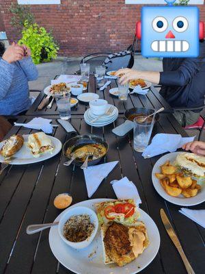 Blackened grouper plate (front center), cheeseburger po´boy with pigtails (right front)