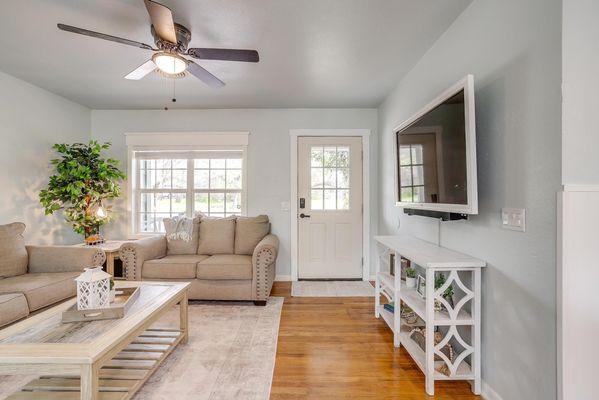 Living room with large 55" television with complimentary Netflix and many local channels.