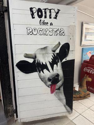 The fun cow art in the Milk Bar captures the vibe of The Studio Experience -- serious about art but also ready to party (or potty).