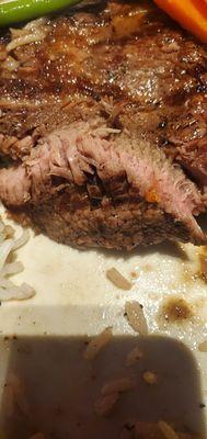 Here's a closeup look of the middle piece of a well-done ribeye. I asked for medium rare.