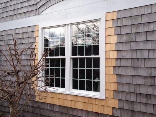 New construction mulled window unit with cedar shingle tie in.