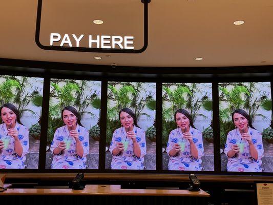 Check out counter with a large TV display.