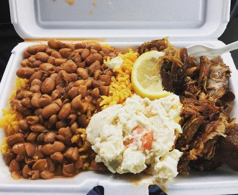Yellow rice, beans, pernil, potatoe salad