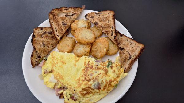 Western omlette, potato cakes, cinnamon raison toast... was delicious