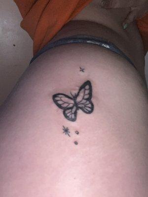 Butterfly tattoo on my hip, covering a scar I have.