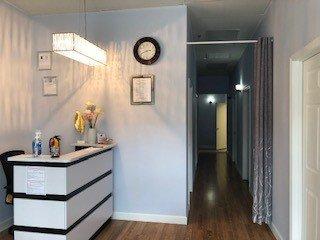 Very nice open area with beautiful paintings on the walls. A modern and warm environment for professional massage therapy.