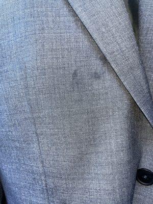 stain on a brand new suit jacket