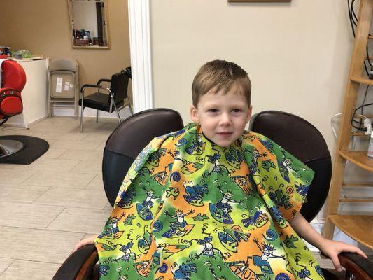 Greyson was very happy with his haircut.He got two lollipops for being such a good boy.