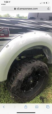 Truck being pulled out of mud