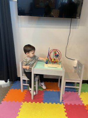 our son enjoying the play area for kids - they're super kid friendly and we very much appreciate it!