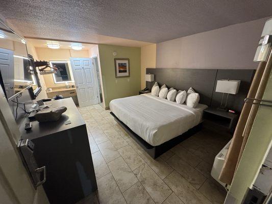 A comfortable room with a nice big TV to finish your day.