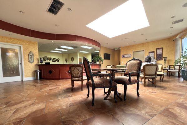 Cozy Lobby/Waiting area w/ great natural lighting. Plenty of seats & tables too.