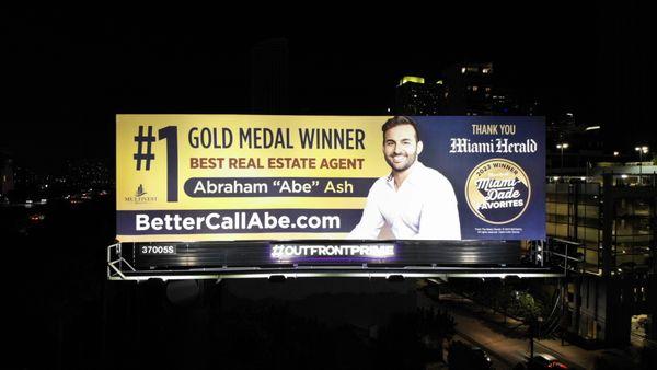 Billboard in Brickell, Miami on I-95 highway featuring my Gold medal award