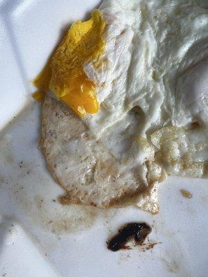 Supposed to be fried egg cooked over-medium. This is Disgusting. Very over cooked. What is that nasty black stuff?