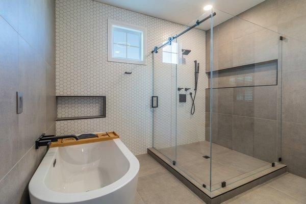 90 Degree Frameless Euroslider Shower. This is our one sliding door barn door system also featuring Ultra Clear Glass!