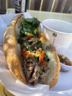 grilled bread with fresh topping on tender pulled pork