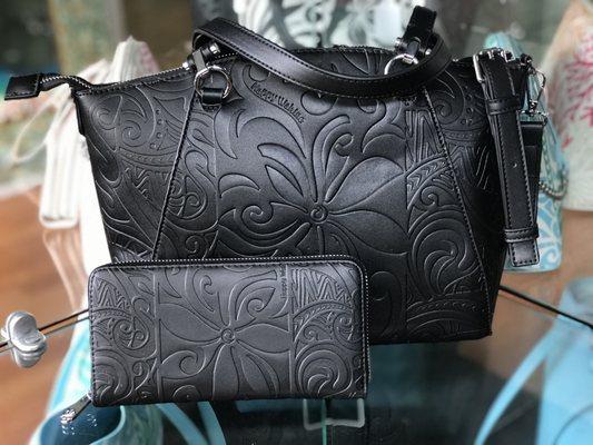 Come see our inventory of Happy Wahine purses and wallets.