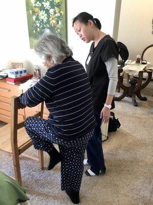RN Instructing a Patient to Do a Home Exercise Program
