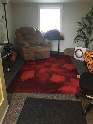 Here's my lovely office. It's cozy and has lots of natural light. Come get deeply relaxed in the big reclining chair.