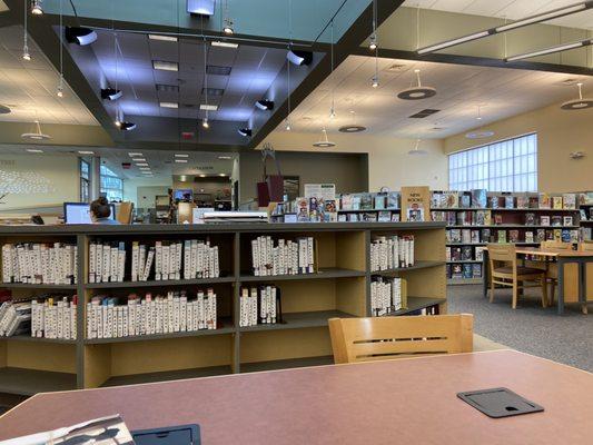 View of right side looking towards the front. Shelf of books patrons have placed on hold