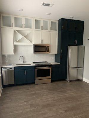 Studio kitchen. Love those cabinets.