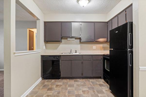 Kitchen with black appliances and grey cabinets
