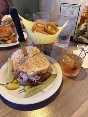 Pastrami Reuben, onion rings and an old-fashioned