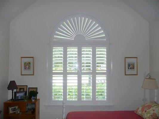 Plantation Shutter with Sunburst Arch.
