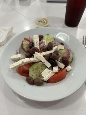Horiatiki Village salad -fresh, light, tomatoes,cucumbers,onions, Kalamata olives, feta, seasoned