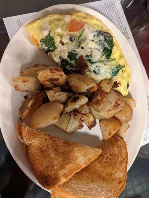 Greek omelet with home fries and toadt