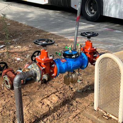 A backflow prevention assembly installed above ground, without a cage. For irrigation, fire suppression, or commercial water service.