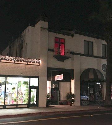 Felix Hair sign in front and a mysterious window on the second floor