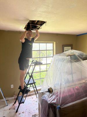 repairing a hole in the ceiling