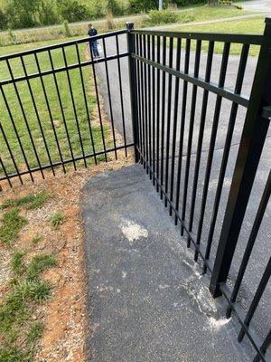Holes of chipping away dry packed concrete where they installed fence crooked a across driveway and had to redo it and fill holes