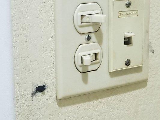Burnt walls dirty light switches.