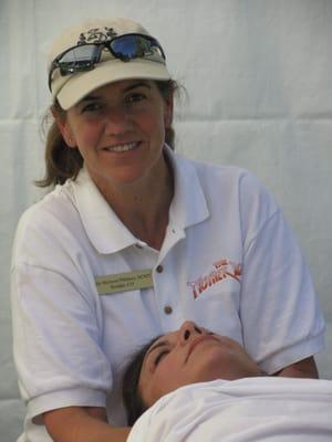 Sally In action releasing a client's neck pain.