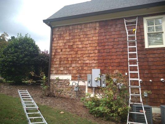 Repaired, stained and weather sealed cedar shake siding.