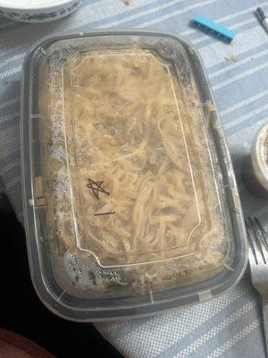 Chicken pad Thai with side of peanut sauce.