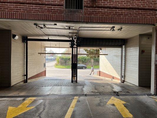 Garage Exit with a Non-working, partially security gate missing.