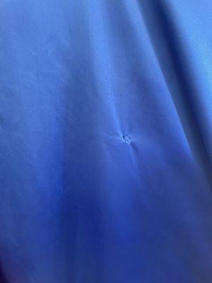 Hole from cleaning damage.