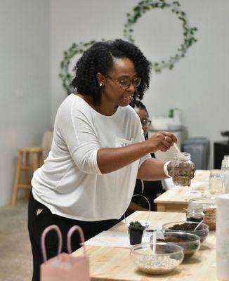 Teaching ladies how to make a terrarium.