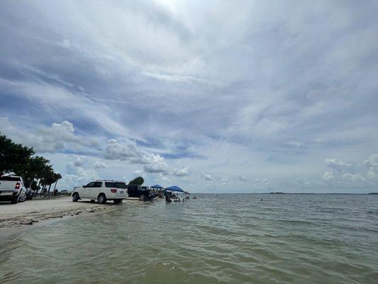 More vehicles parked on the beach