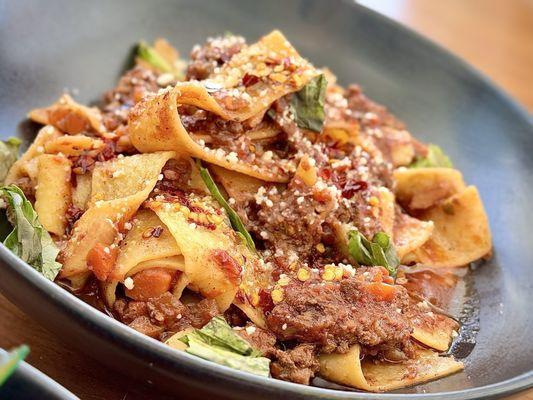 PAPPARDELLE BOLOGNESE 30 M+P pomodoro | M+P chili crunch | pecorino | basil