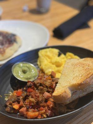 Veggie bowl with scrambled soft eggs and sourdough