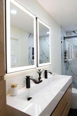 The new electrical panels allowed us to add these lighted mirrors, and shower that has lighting and plays music!